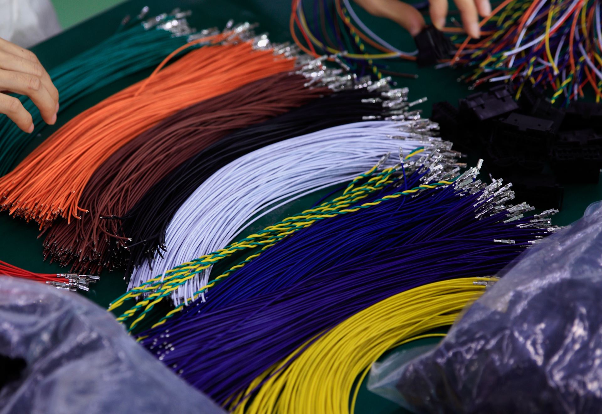 Prepared color-coded conductors at an assembly workstation
