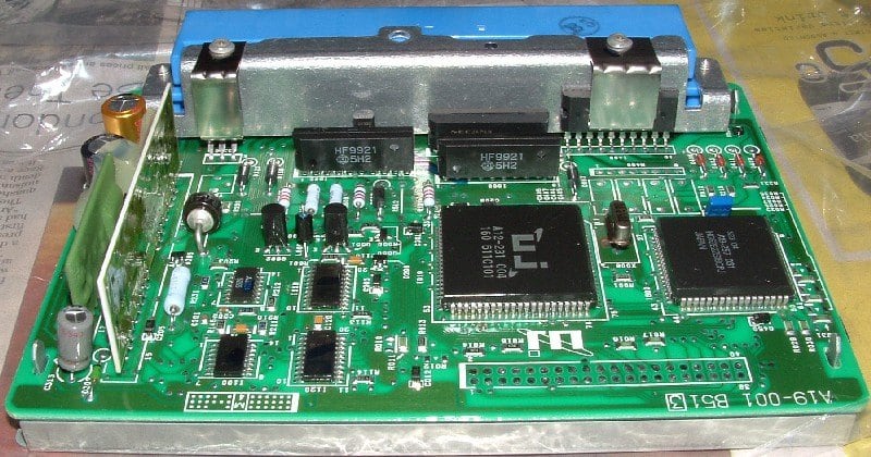 A vehicle ECU and its interface: confirm the equipment reference, not only connector appearance.