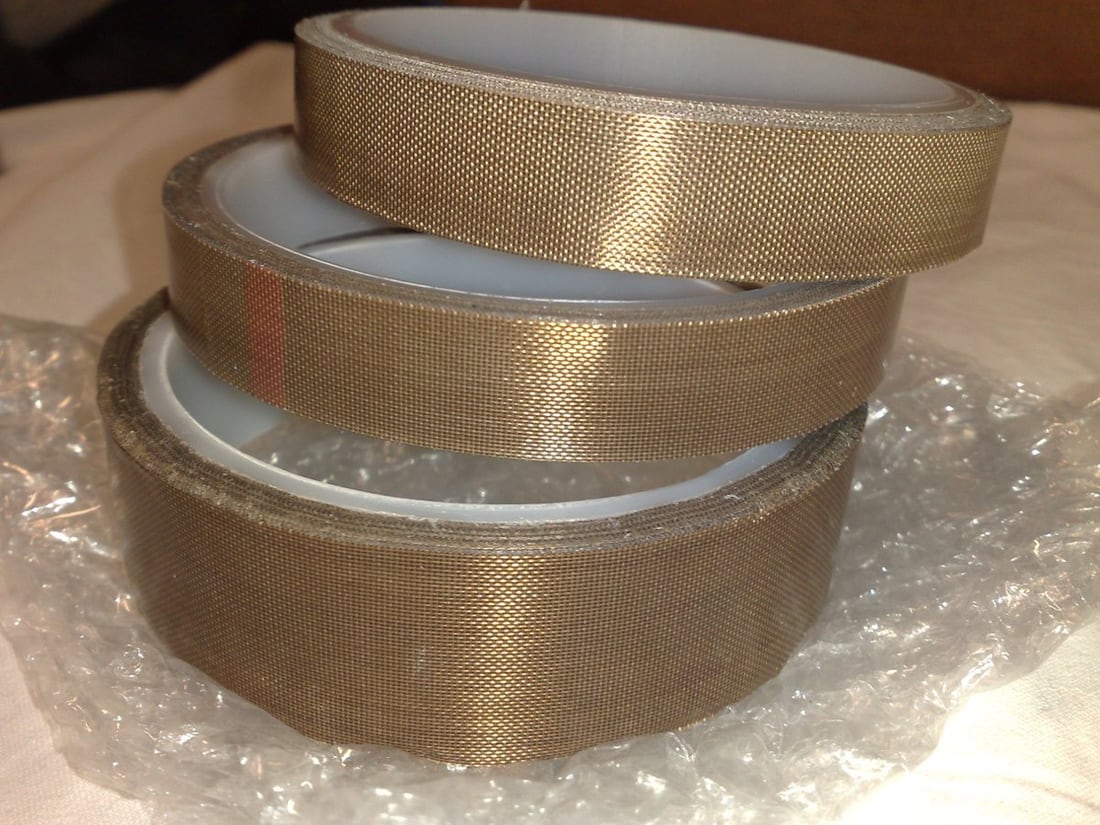 PTFE-backed tapes as a fluoropolymer material example, not a specified cable jacket.