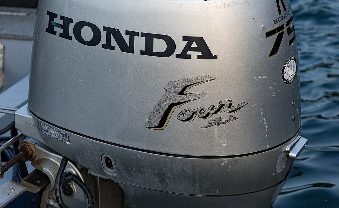 An outboard engine illustrates the spray and corrosion environment around marine equipment.