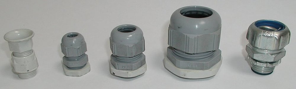 Cable glands in different materials illustrate mounting and cable-entry choices.