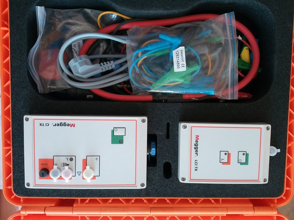 Cable identification equipment illustrates circuit tracing during installation.