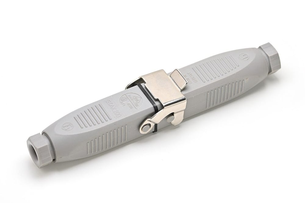 Secured Hirschmann industrial connector illustrates a mechanical retention feature; not a Binder interchangeability claim.