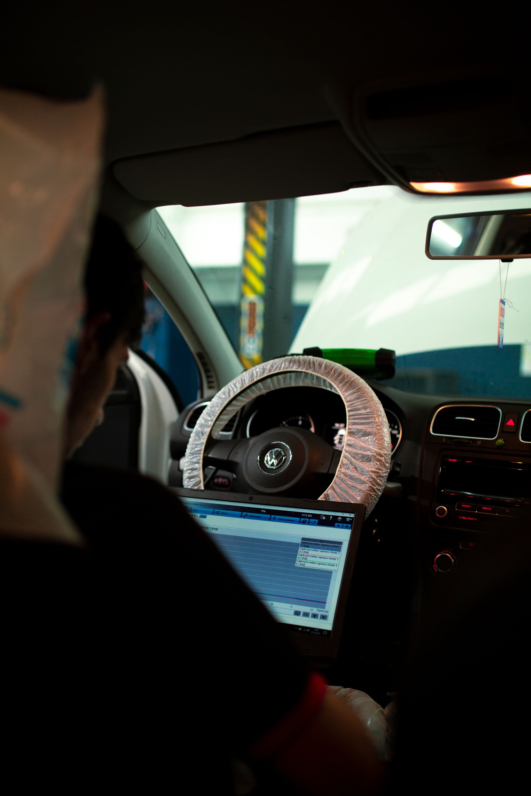 Vehicle technician reviewing diagnostic network data