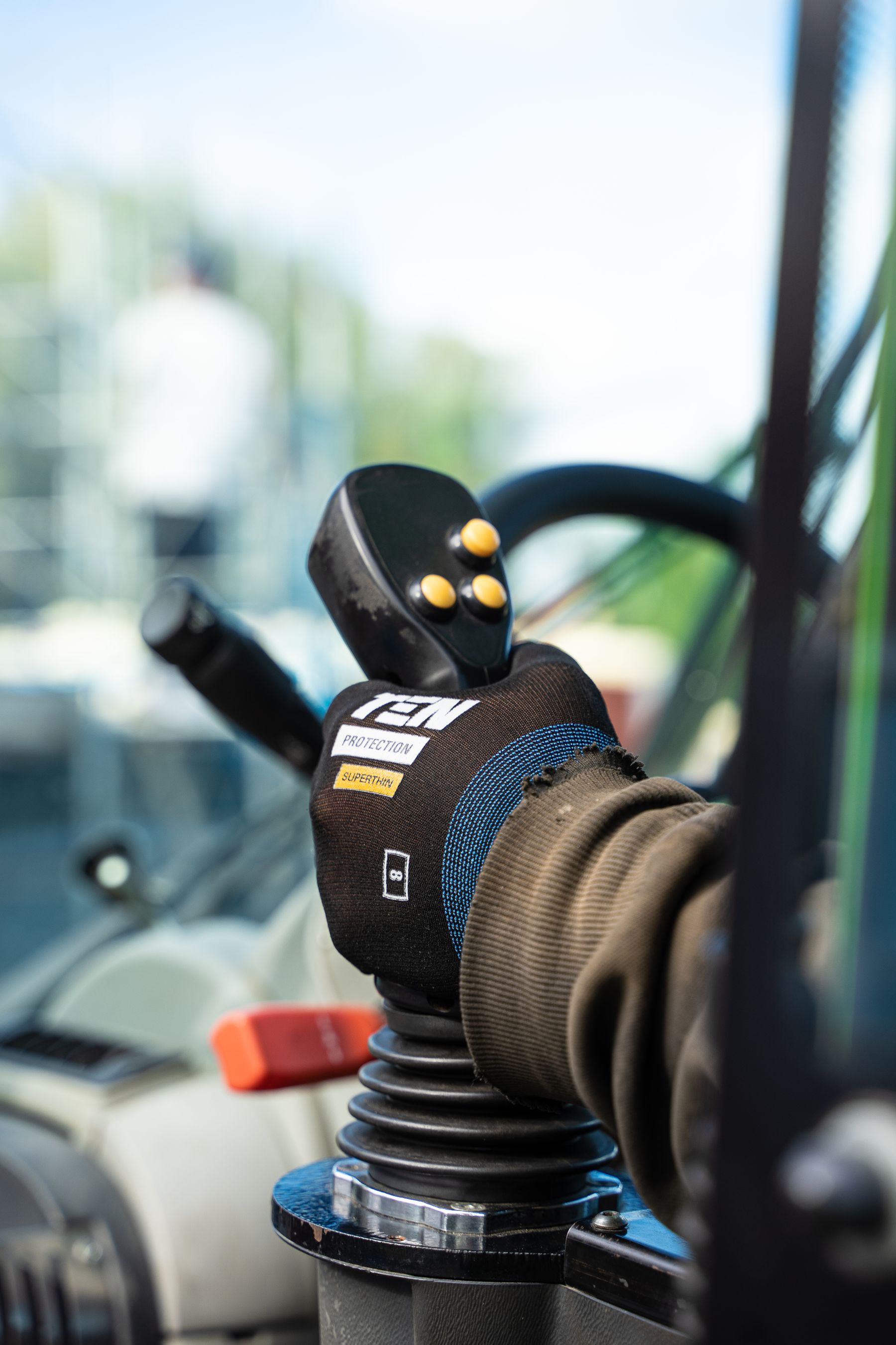Operator joystick inside a construction-machine cab
