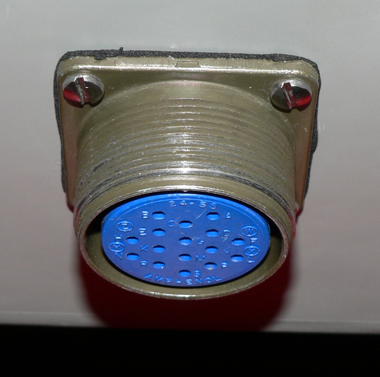Close-up of numbered cavities in a third-party circular panel socket