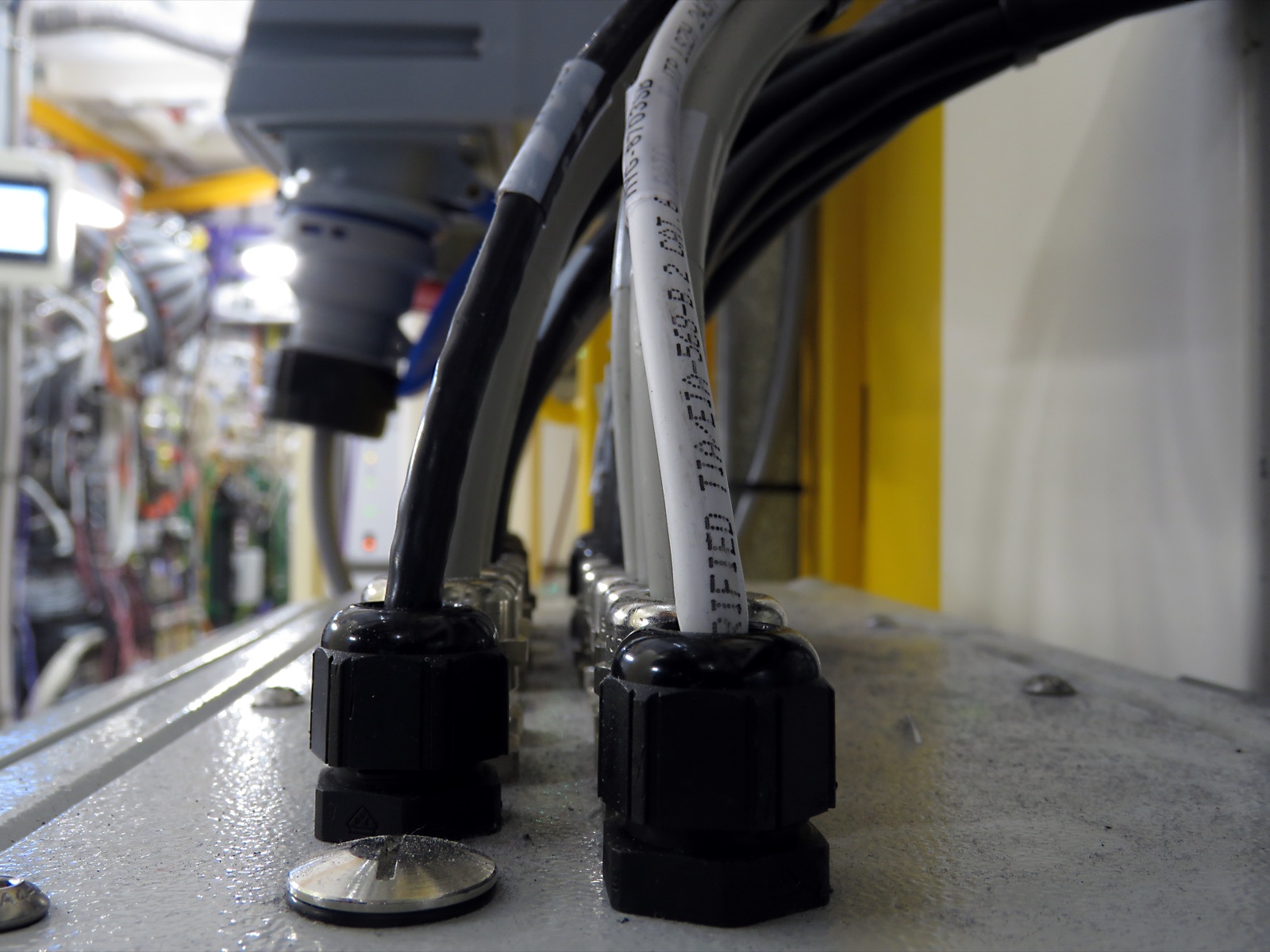 Cables entering an equipment box through several cable glands
