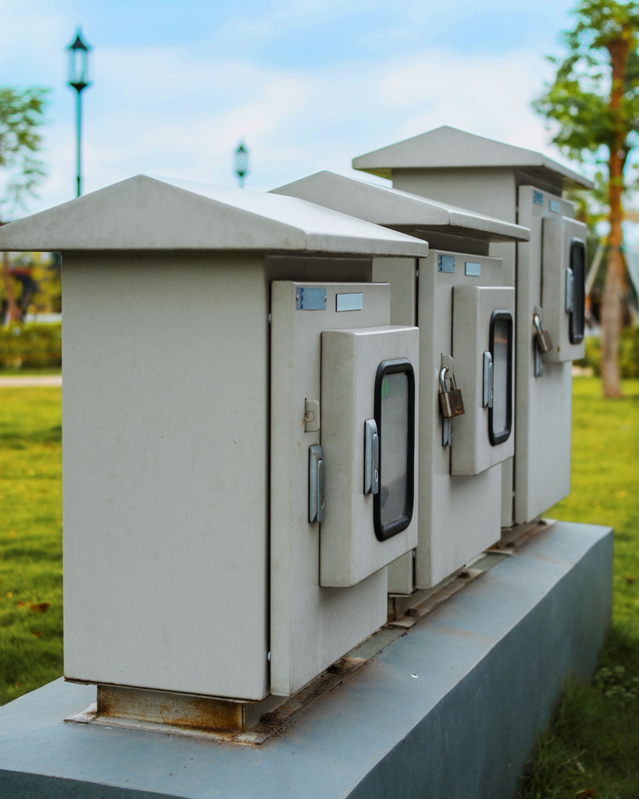 Outdoor electrical boxes with protective metal covers