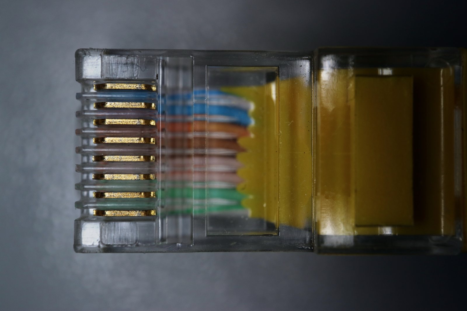 Colored conductors and metal contacts inside a transparent RJ45 plug