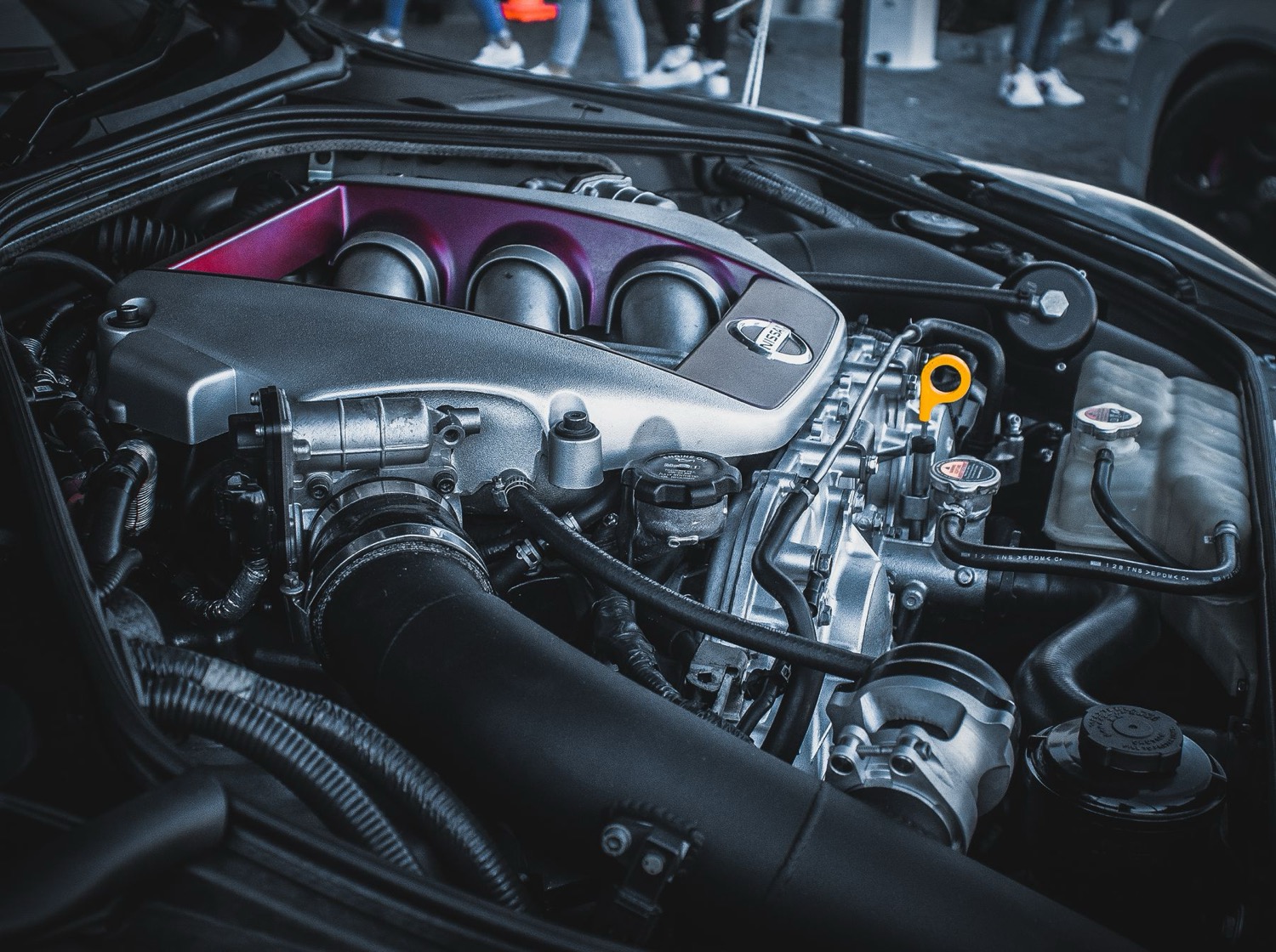 Piping and cables in a vehicle engine compartment