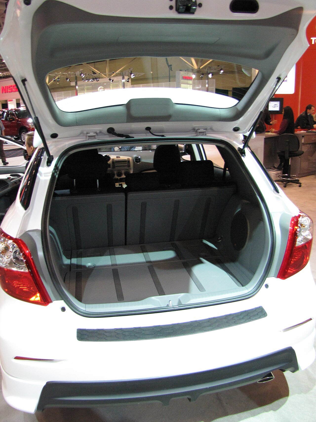 Moving tailgate routes need travel clearance and a supported service loop.