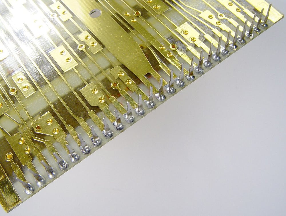 A calculator circuit-board connection illustrates a permanent internal assembly context.