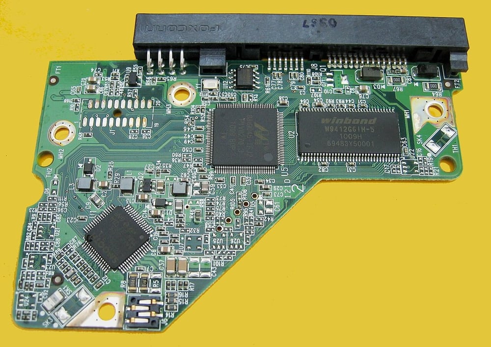 Corroded contact pads on a disk-controller board illustrate a real contamination-related surface condition.