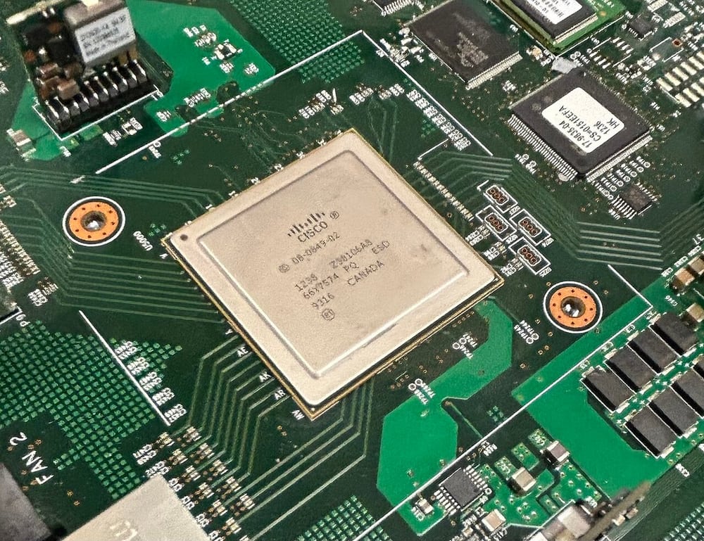 A network-switch circuit board illustrates data-equipment integration.