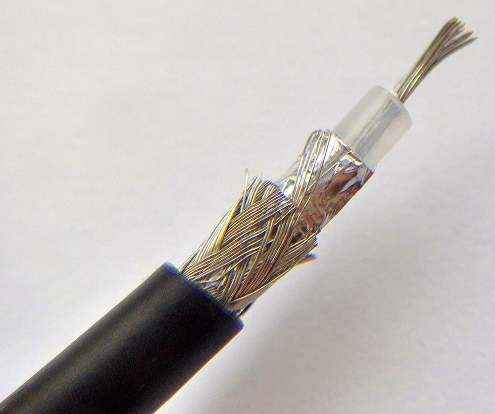 A cut coaxial cable reveals the shield and insulation layers.