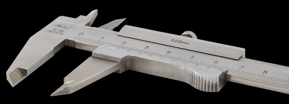 A vernier caliper illustrates dimensional verification against a drawing.