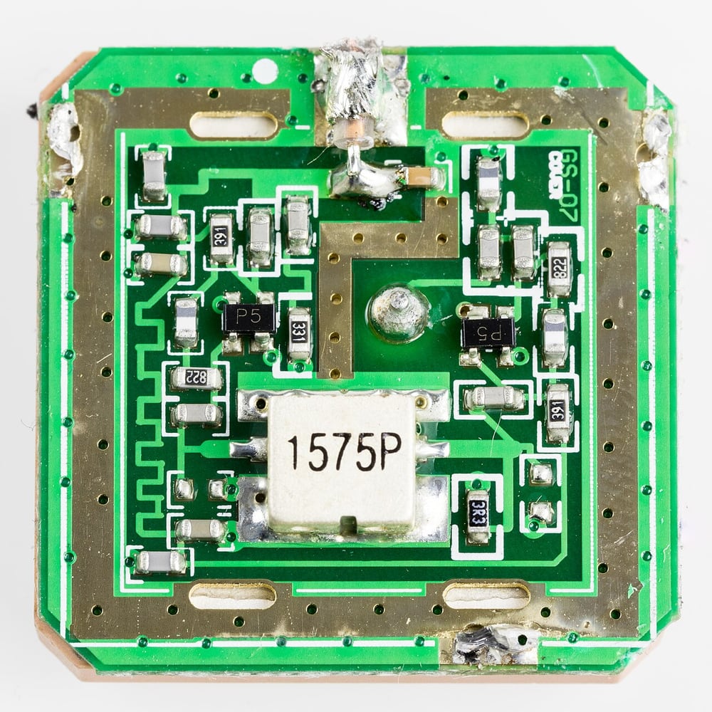 An active GPS antenna exposes its electronics beneath the cover.