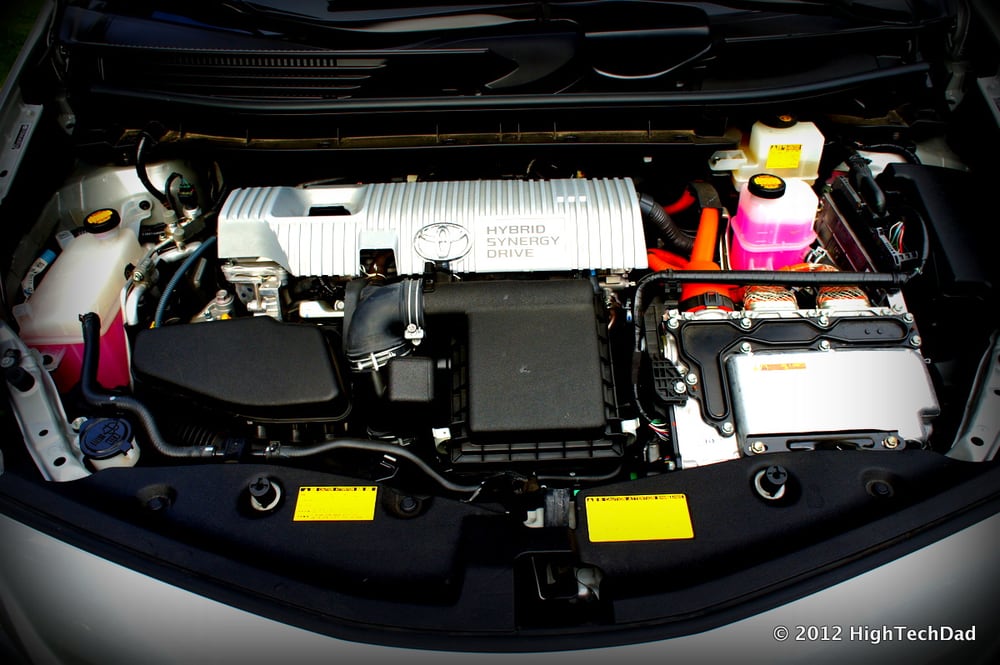 A hybrid engine bay illustrates the restricted space around power-conversion equipment.