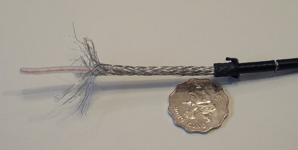 Braid on a coaxial cable illustrates a conductive shield layer, not a high-voltage cable specification.