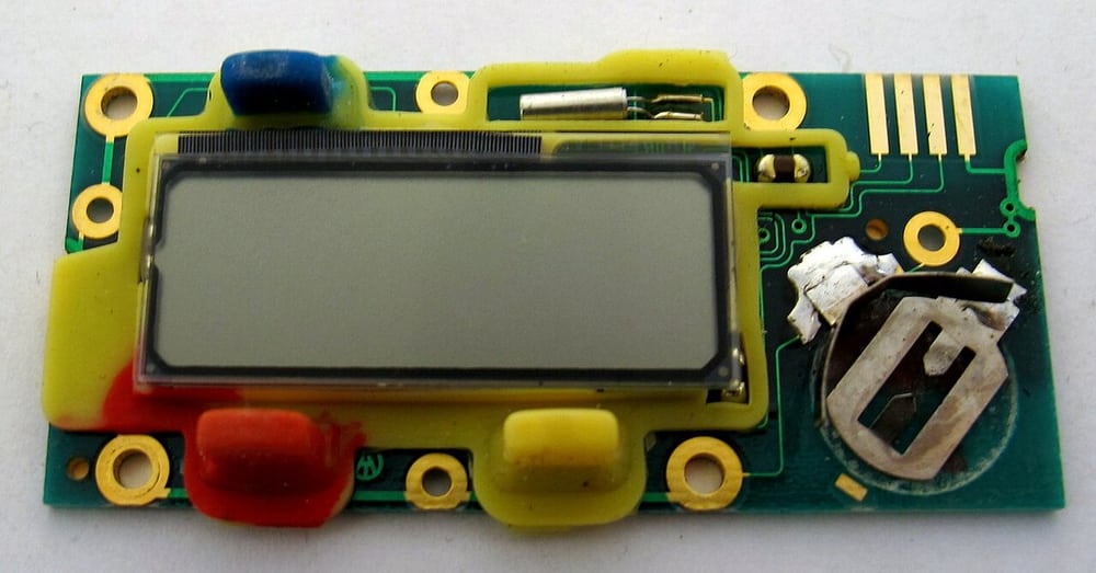 Electronics inside a digital caliper illustrate compact instrument packaging.