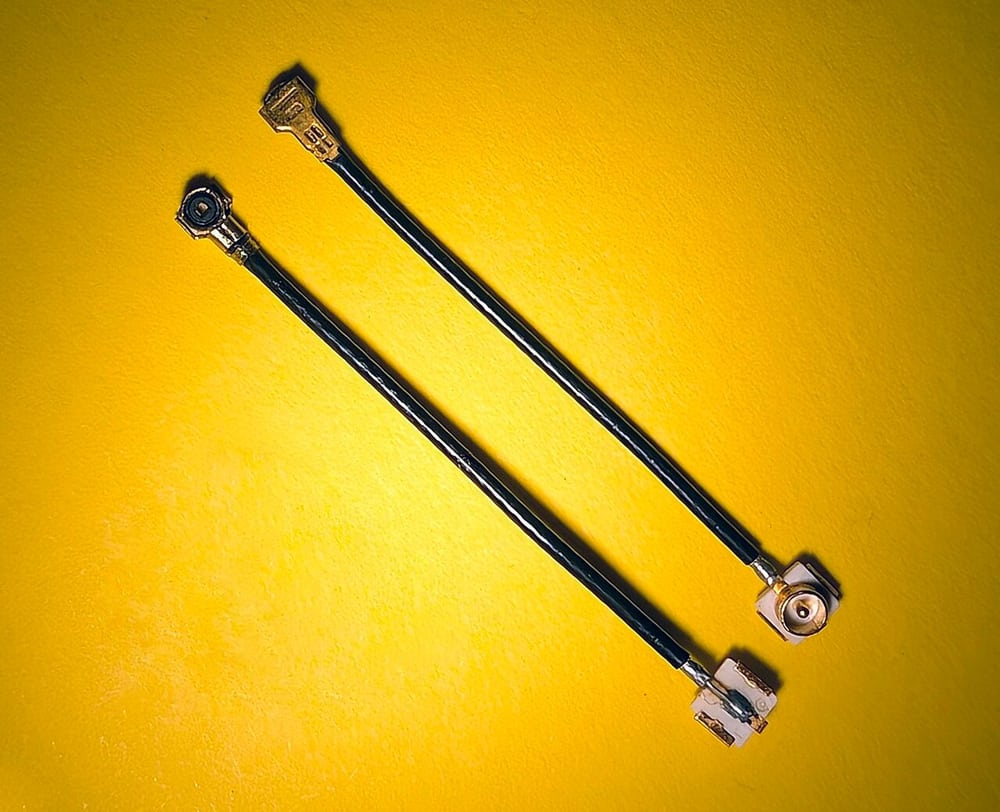 MHF4-to-U.FL adapter leads demonstrate distinct interface ends rather than universal compatibility.