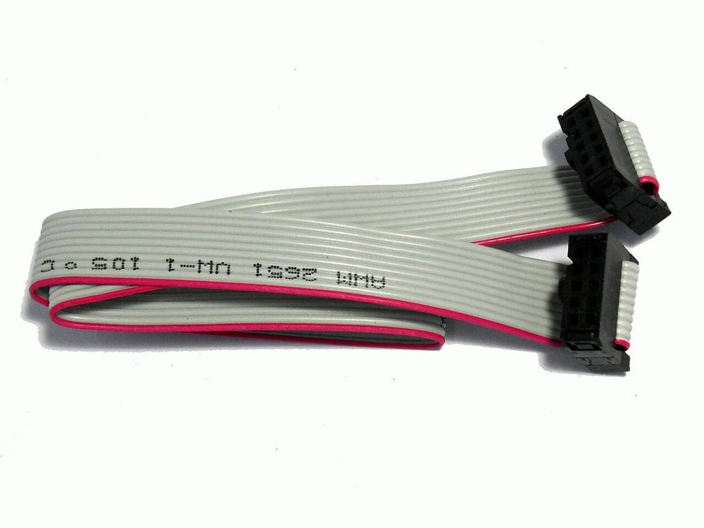 Ribbon cable separates conductor arrangement from the connector-selection decision.