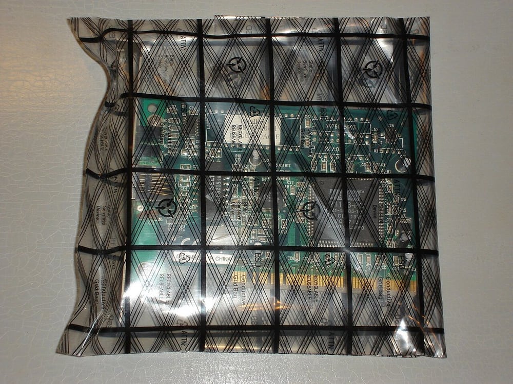 Circuit board in an antistatic bag illustrates protection during storage and handling.