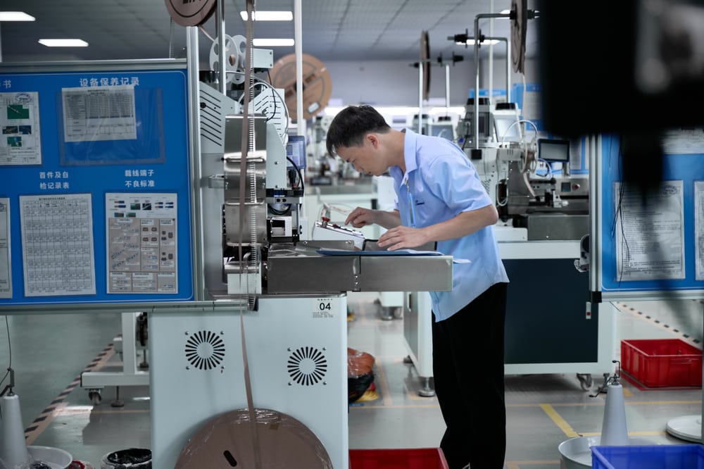 Super Smile production workstation; the released process defines each order's build.