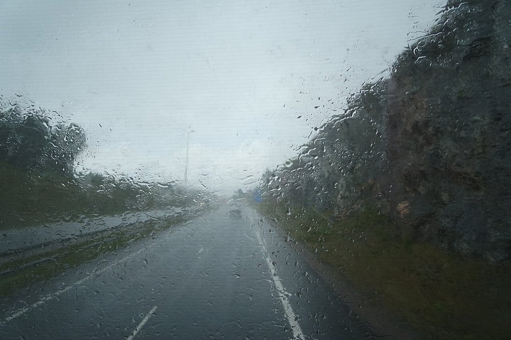 Rain seen through a windshield represents a wet environment, not an IP certification result.