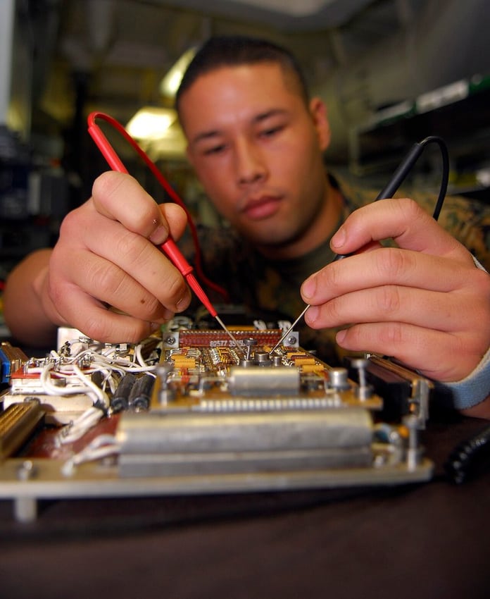 An avionics maintenance scene illustrates controlled equipment work; no affiliation or qualification is implied.