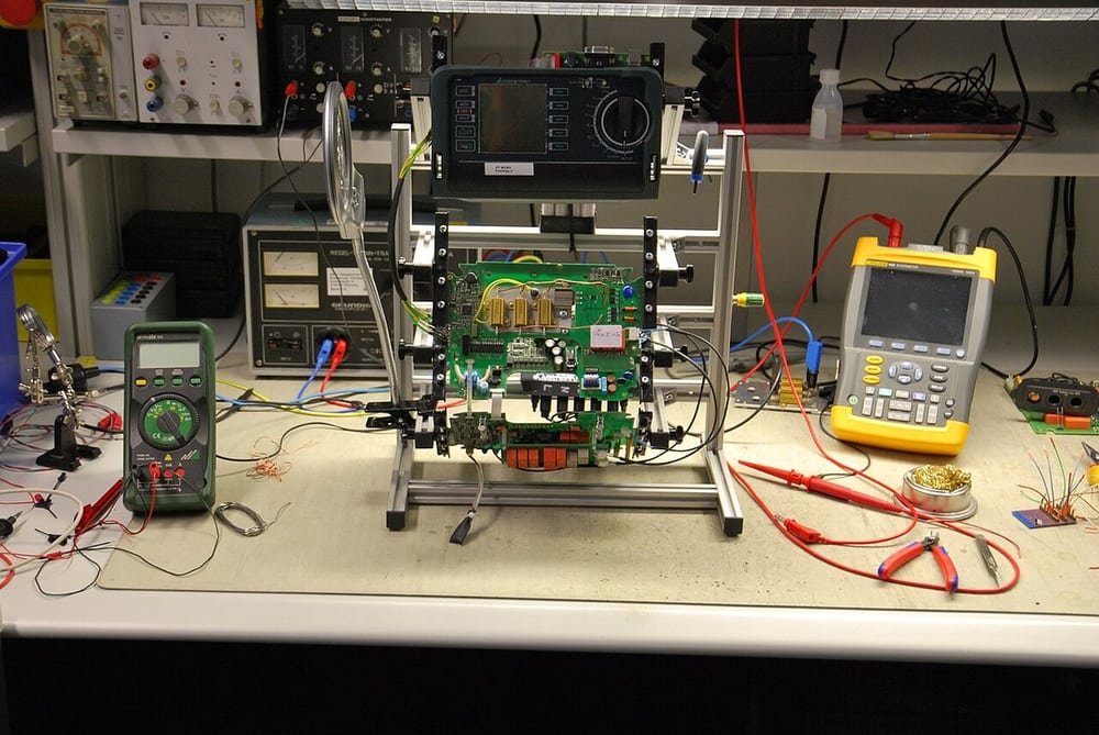 An electronics test setup illustrates planning around the connected equipment before additional tests.