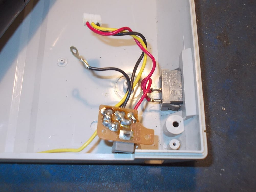 Wiring inside a small enclosure illustrates the need for accessible connections and support.