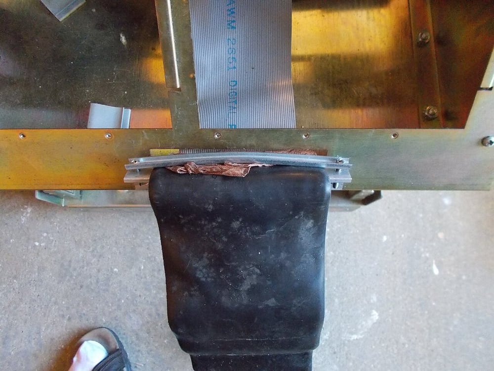 A cable clamp in equipment illustrates taking mechanical load away from a termination.