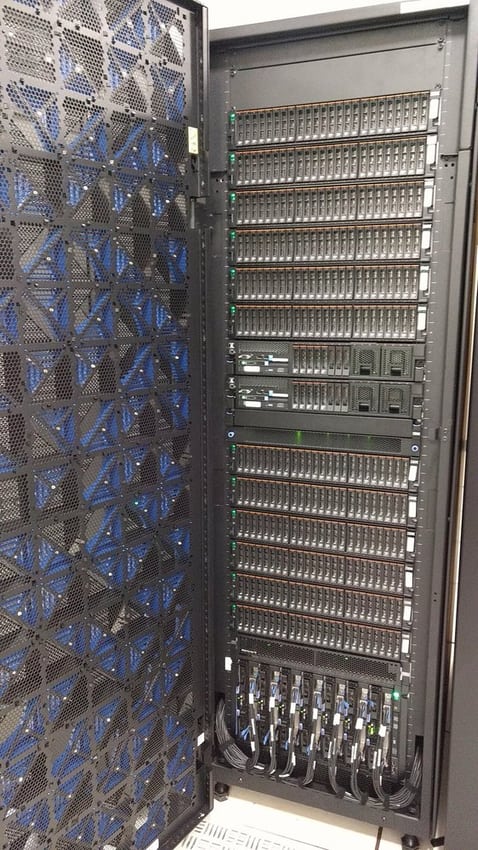 An open equipment rack illustrates module access and cable-routing space.