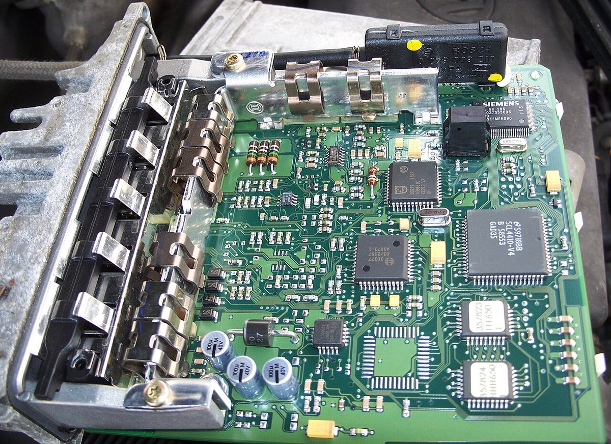 Vehicle control-module interior illustrates the equipment context, not a claim that this module uses JST parts.