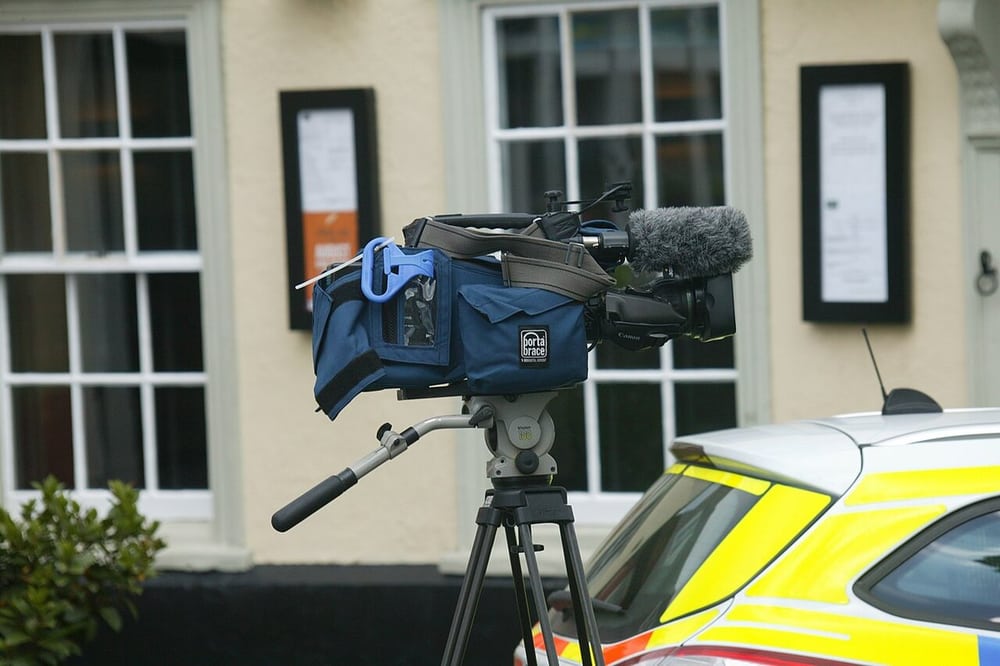A broadcast camera provides the operating context for accessory leads.