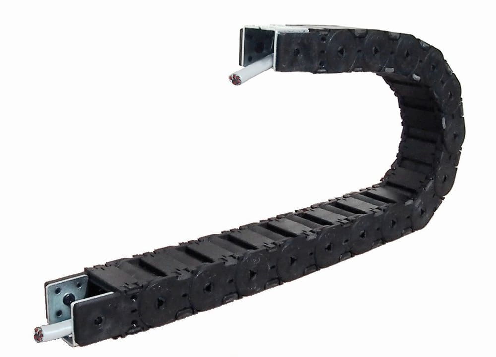 A cable carrier illustrates the defined bend path of a moving installation.