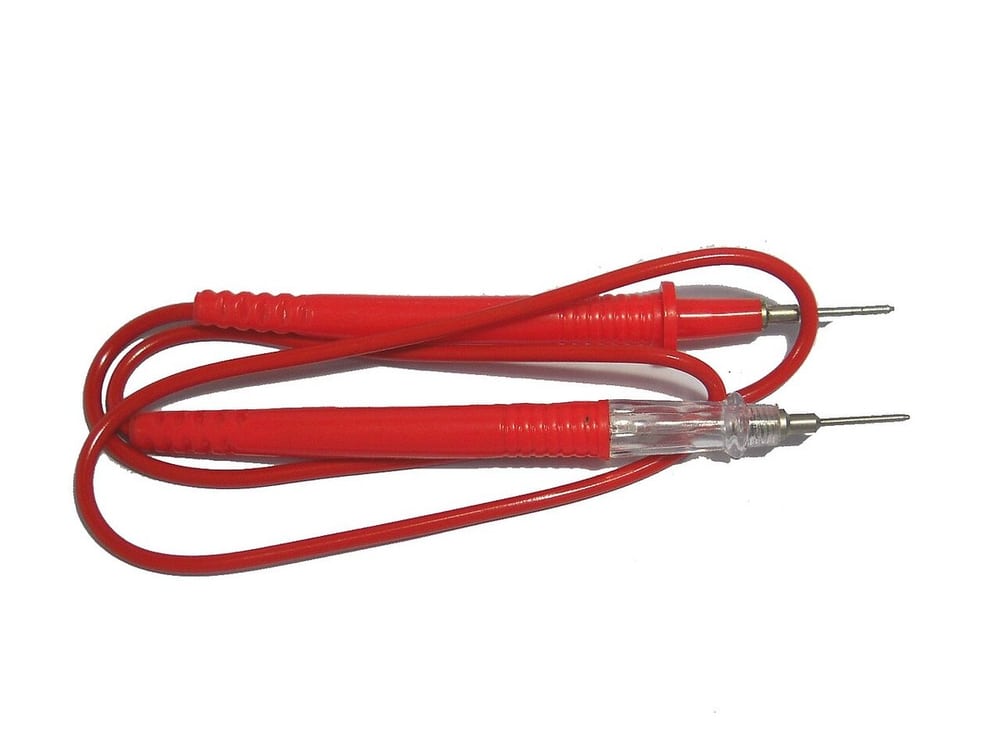 An electrical continuity tester illustrates basic circuit verification.