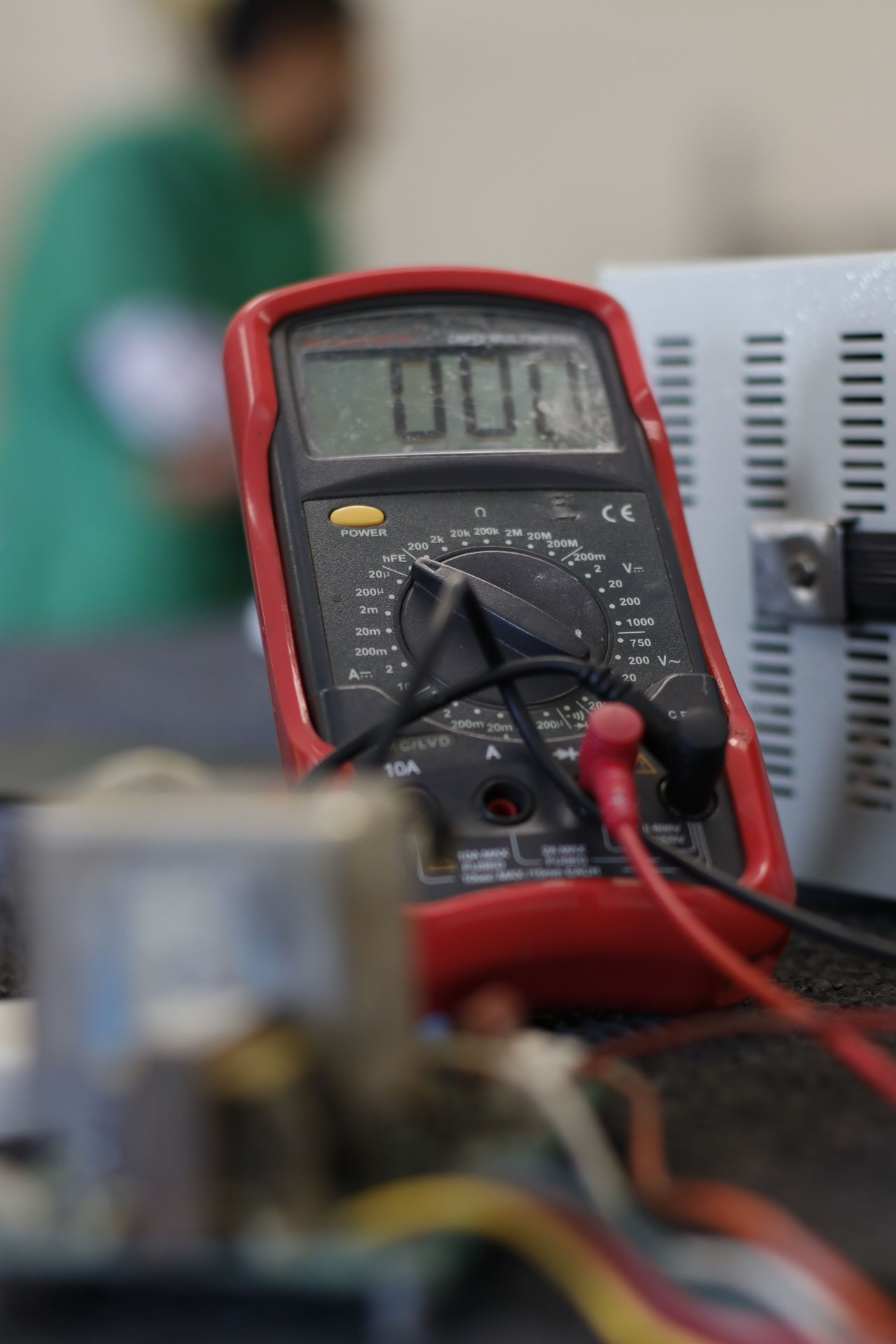 Multimeter with red and black test leads
