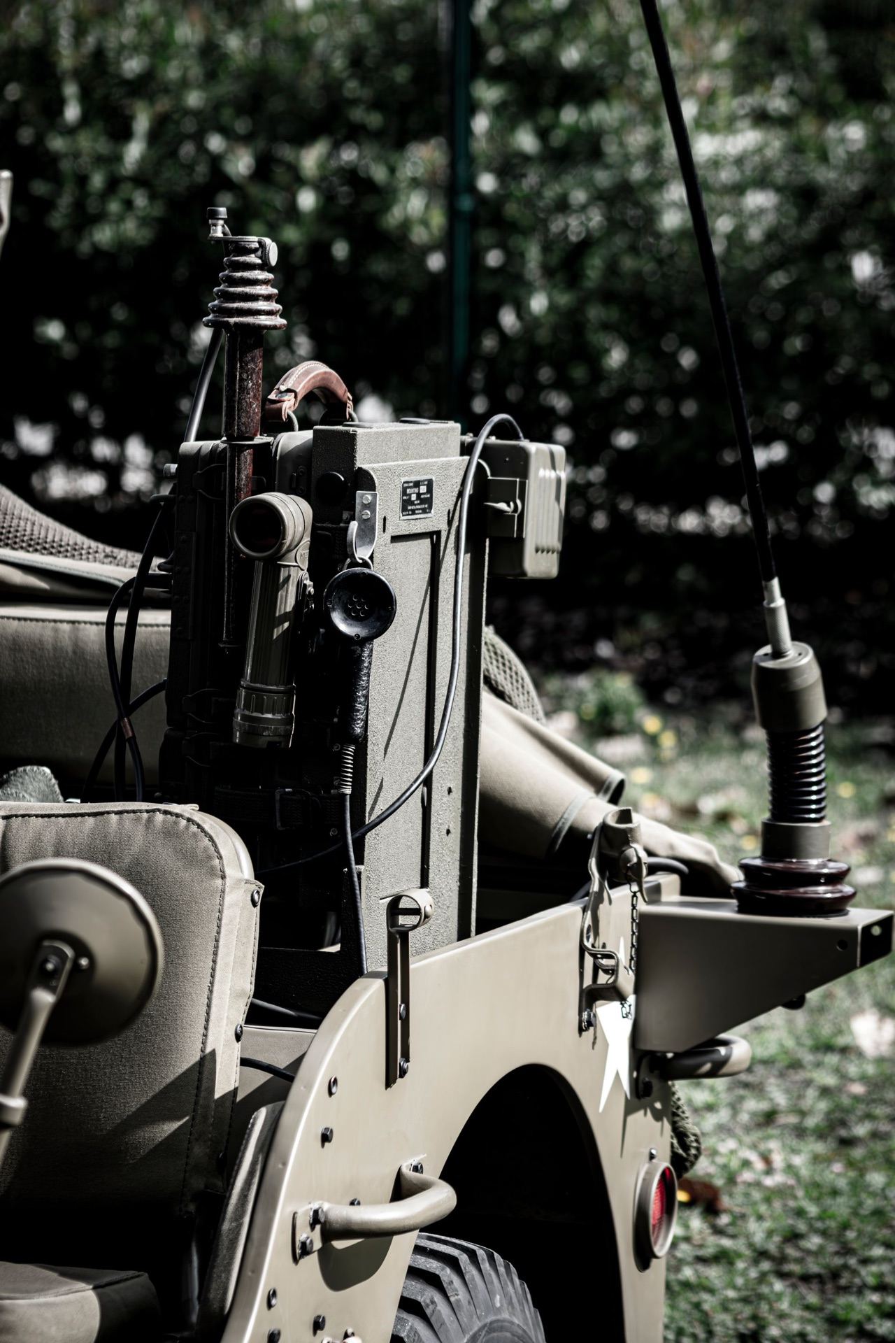 Military ground vehicle and equipment in woodland