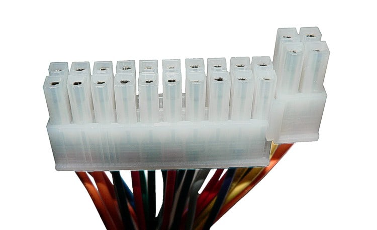 ATX cable-end reference illustrates keyed cavities and terminated wires; exact family and origin require part identification.