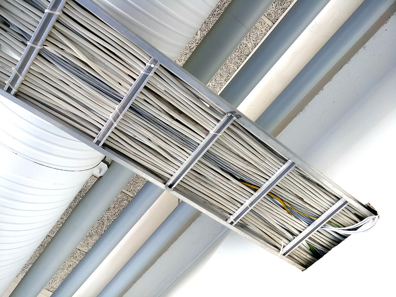 Bundled electrical cables laid in a metal cable tray