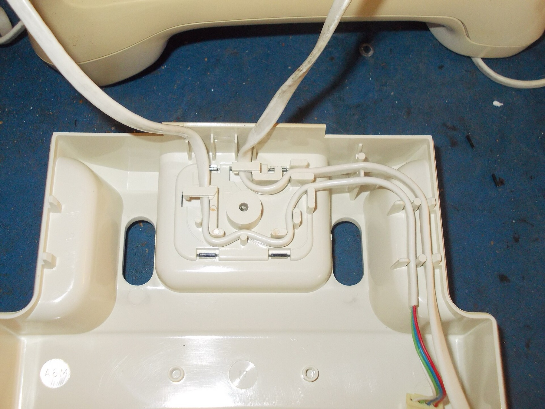 Fine wires retained inside a plastic enclosure