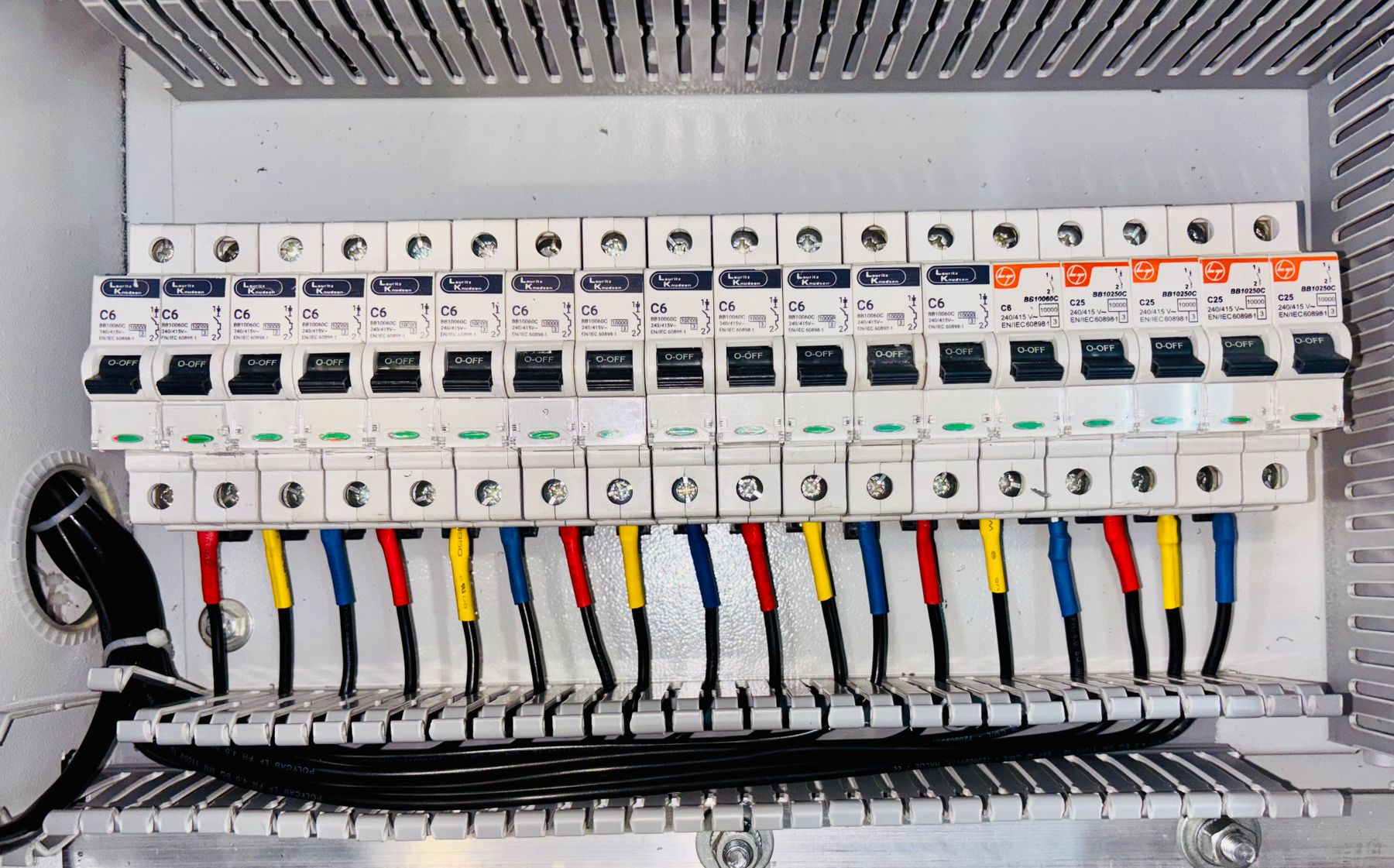 Breakers and multicolored wires in a distribution box