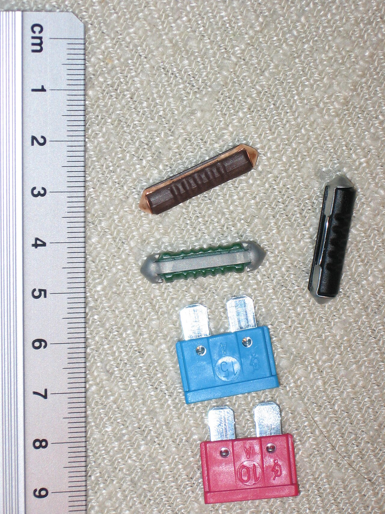 Fuse geometry, rating and holder compatibility must be checked together.