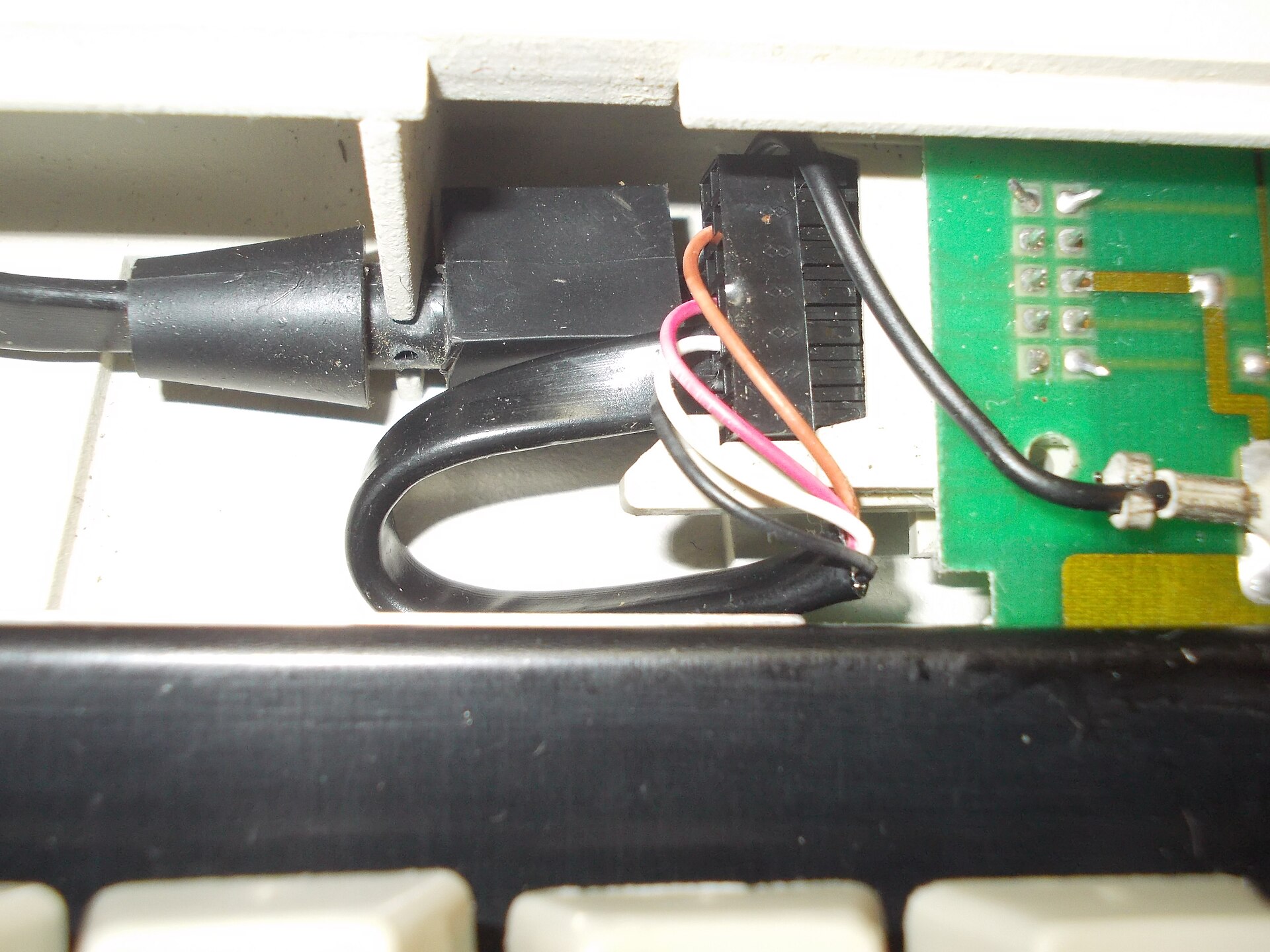 Molded cable strain relief inside equipment