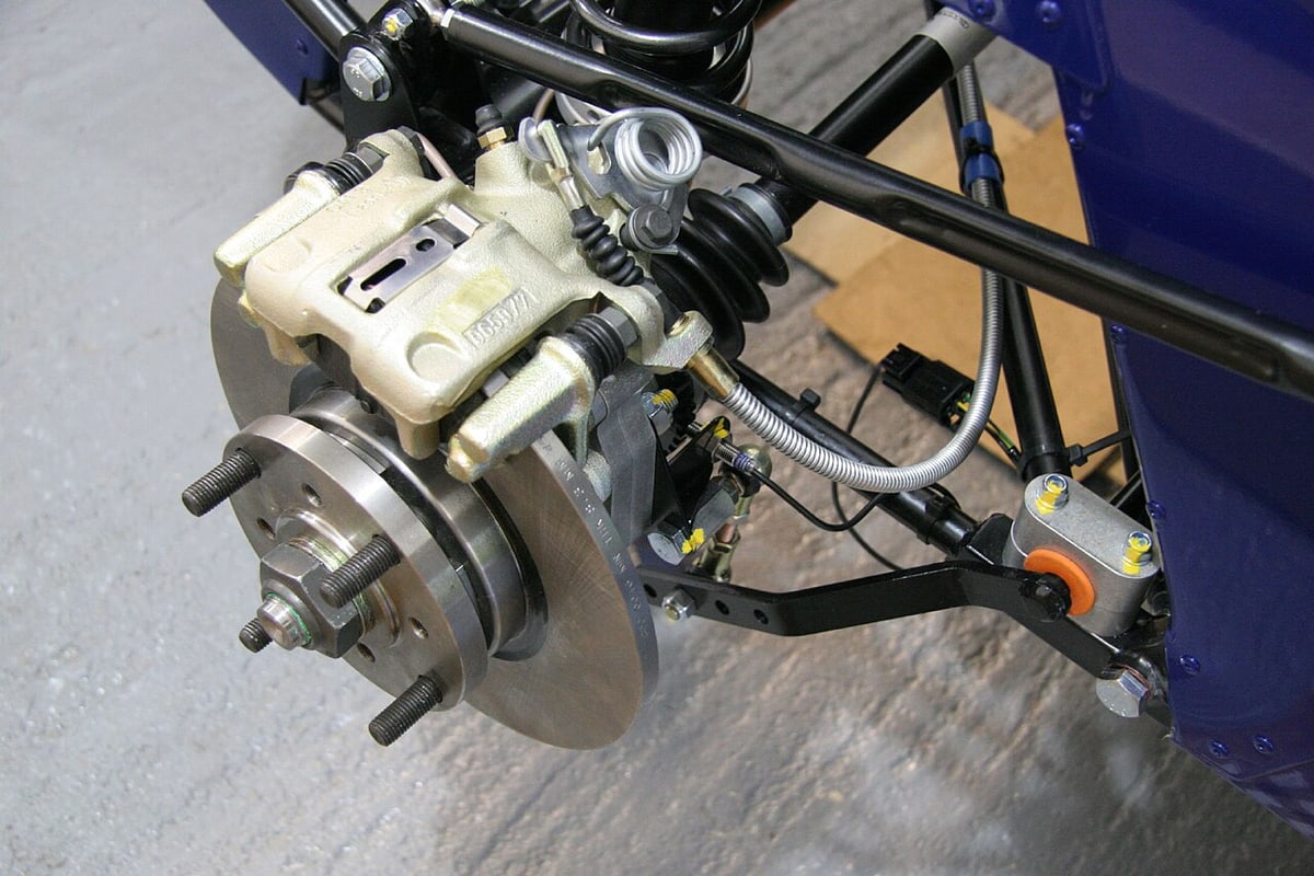 Wheel-speed sensor wiring shows why routing and moving-part clearance need attention; this is not an AMPSEAL product identification.