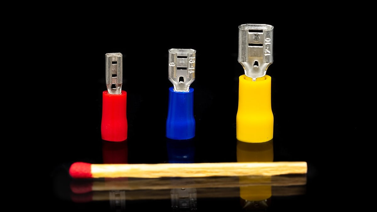 Quick-disconnect terminal forms illustrate blade and receptacle geometry; the reference photo is not proof of TE manufacture.