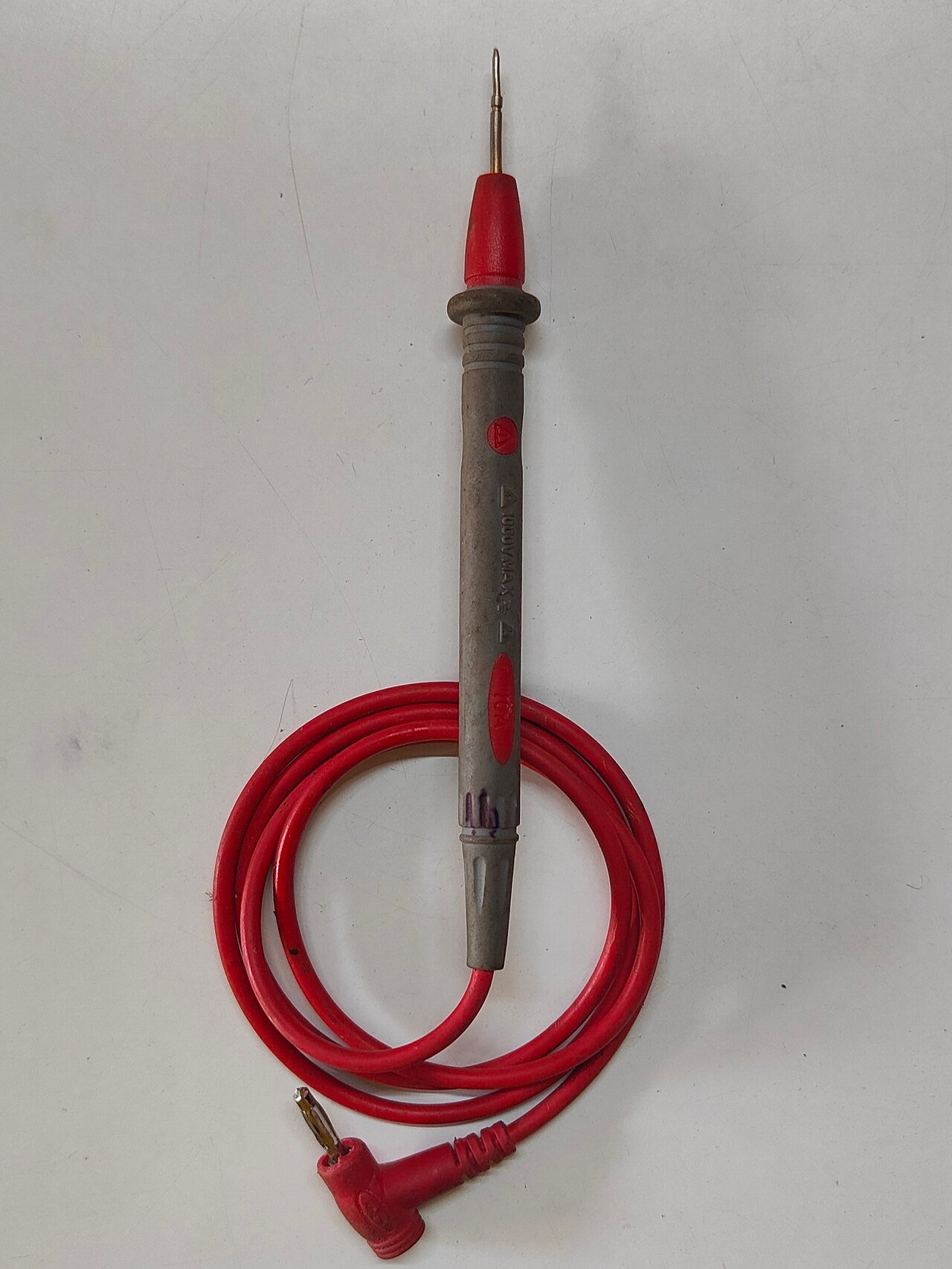 A test probe illustrates the measurement interface; probing must not damage contacts or seals.